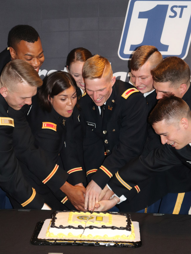 New officers cut a cake