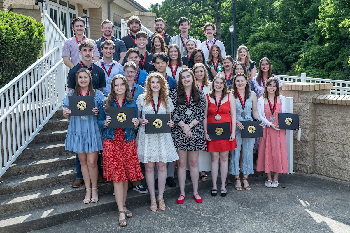 A group of students with their certificates