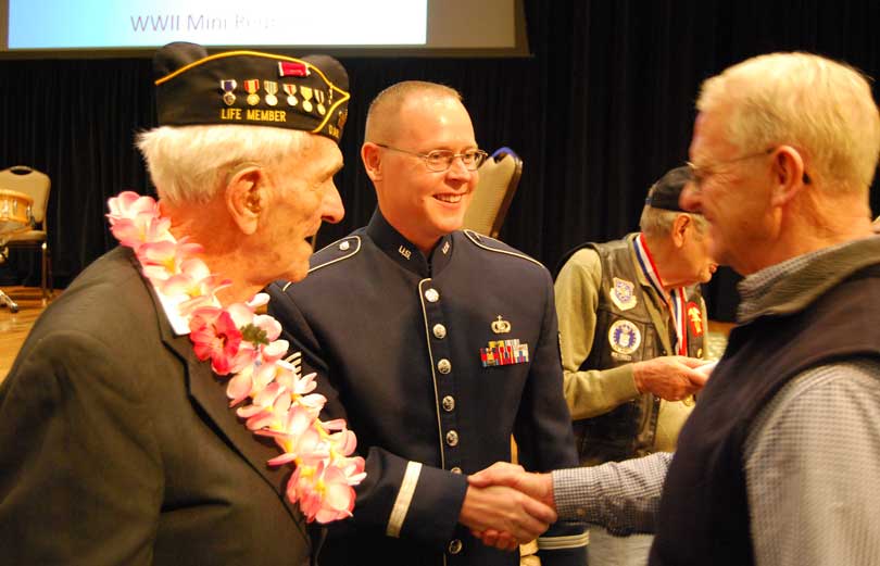 Tech. Sgt. Scott Sauer visits with veterans