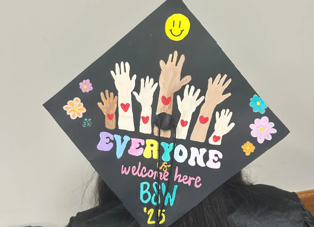 Social worker student in a decorated graduation cap