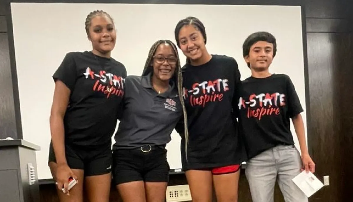 Students pose for a photo during A-State Inspire
