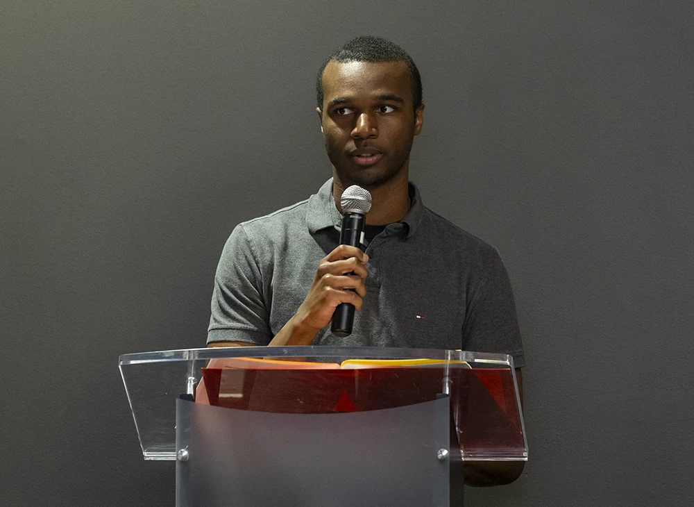 Student speaking at a conference.