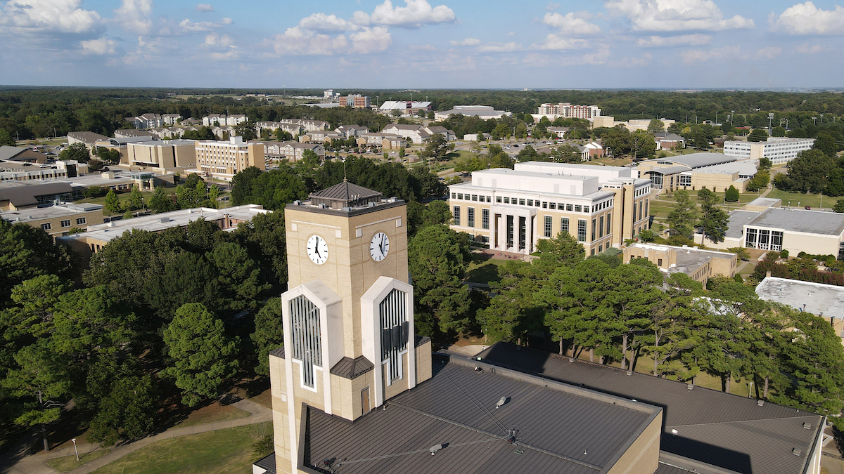 Aerial view of campus with clock tower in the foreground