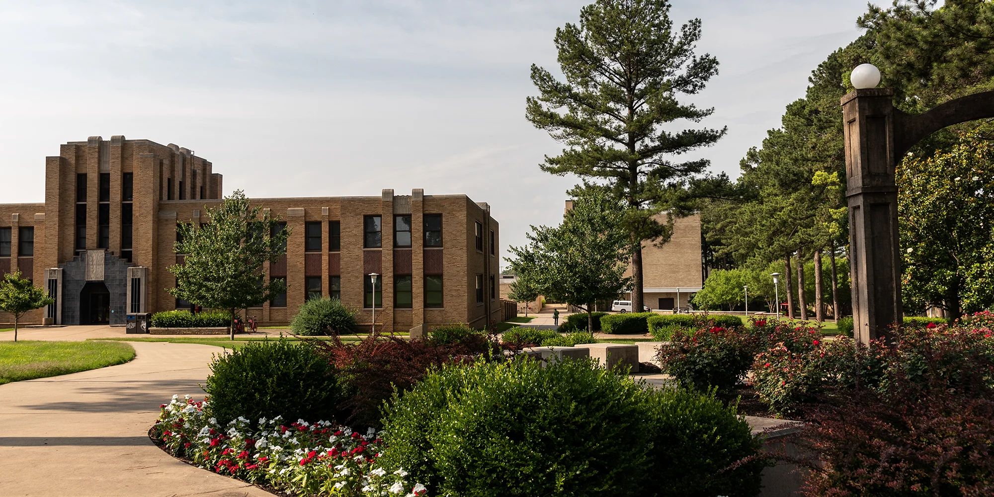 A wide-shot of the Math and Computer Sciences building, the arch, and the lab buildings in the background.