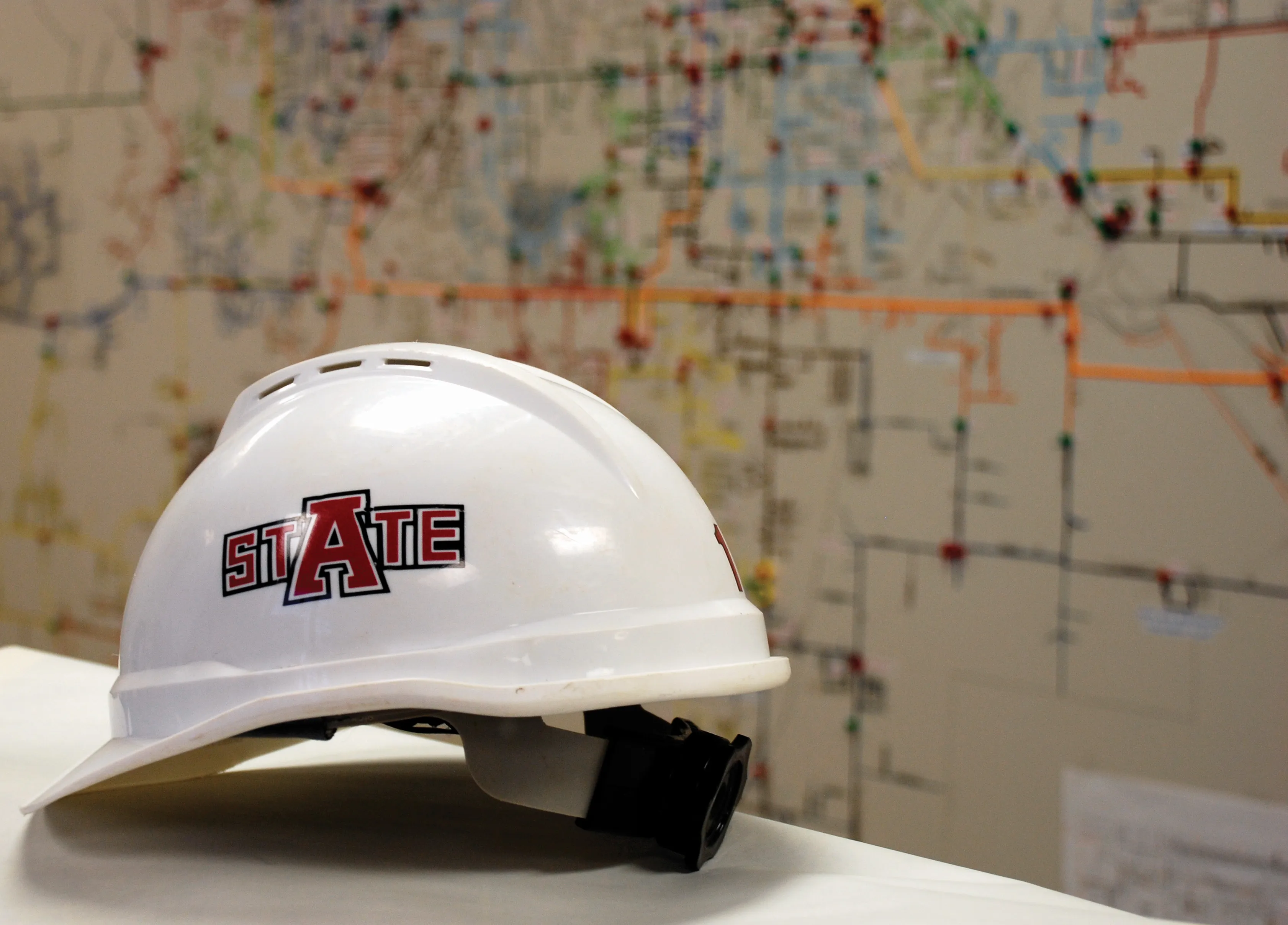 civil engineering hard hat with map of jonesboro behind it showing various data sets.