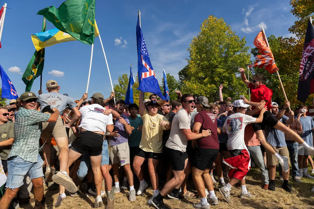 Fraternity members celebrate their new members at their reveal event.