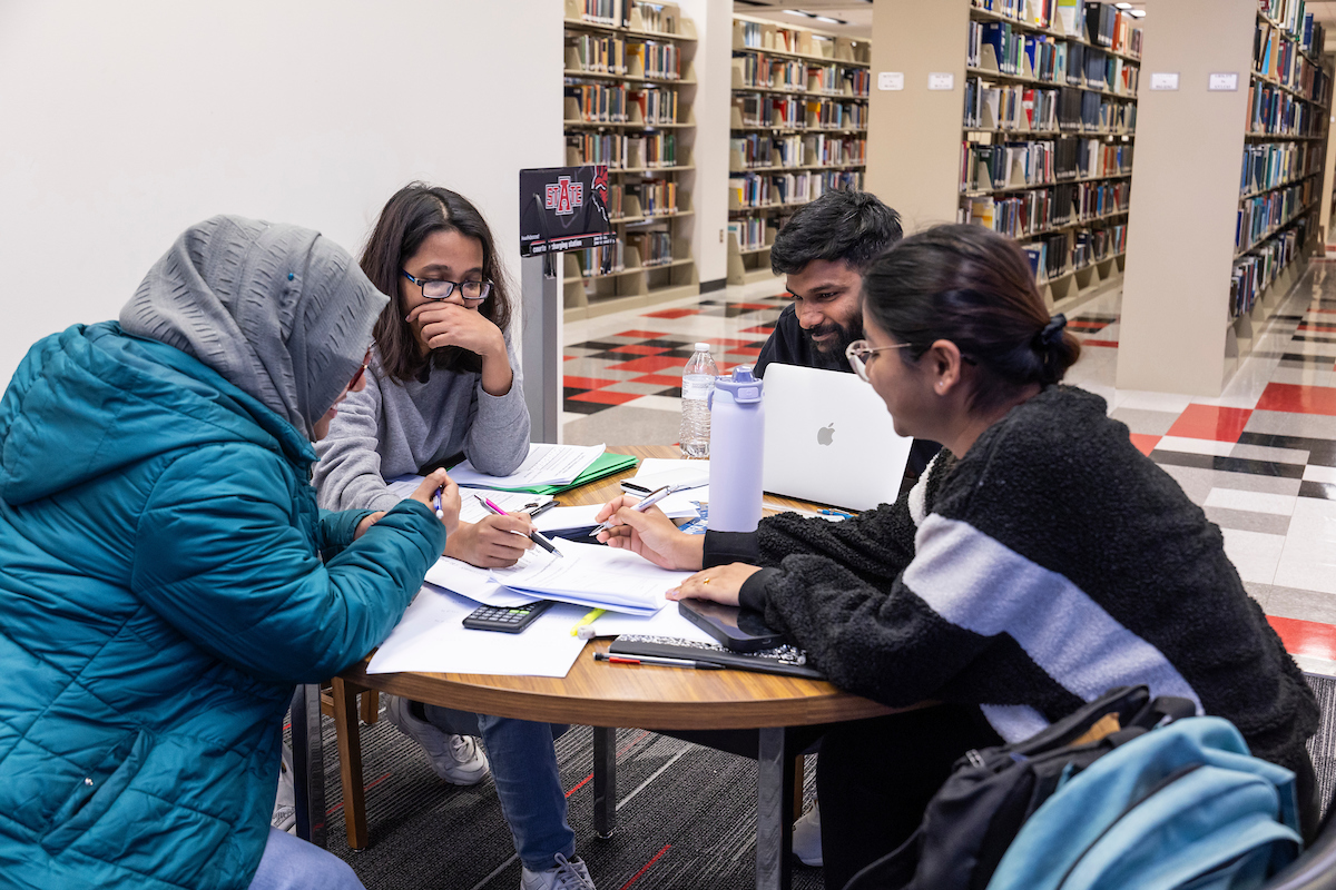 international students studying in the library