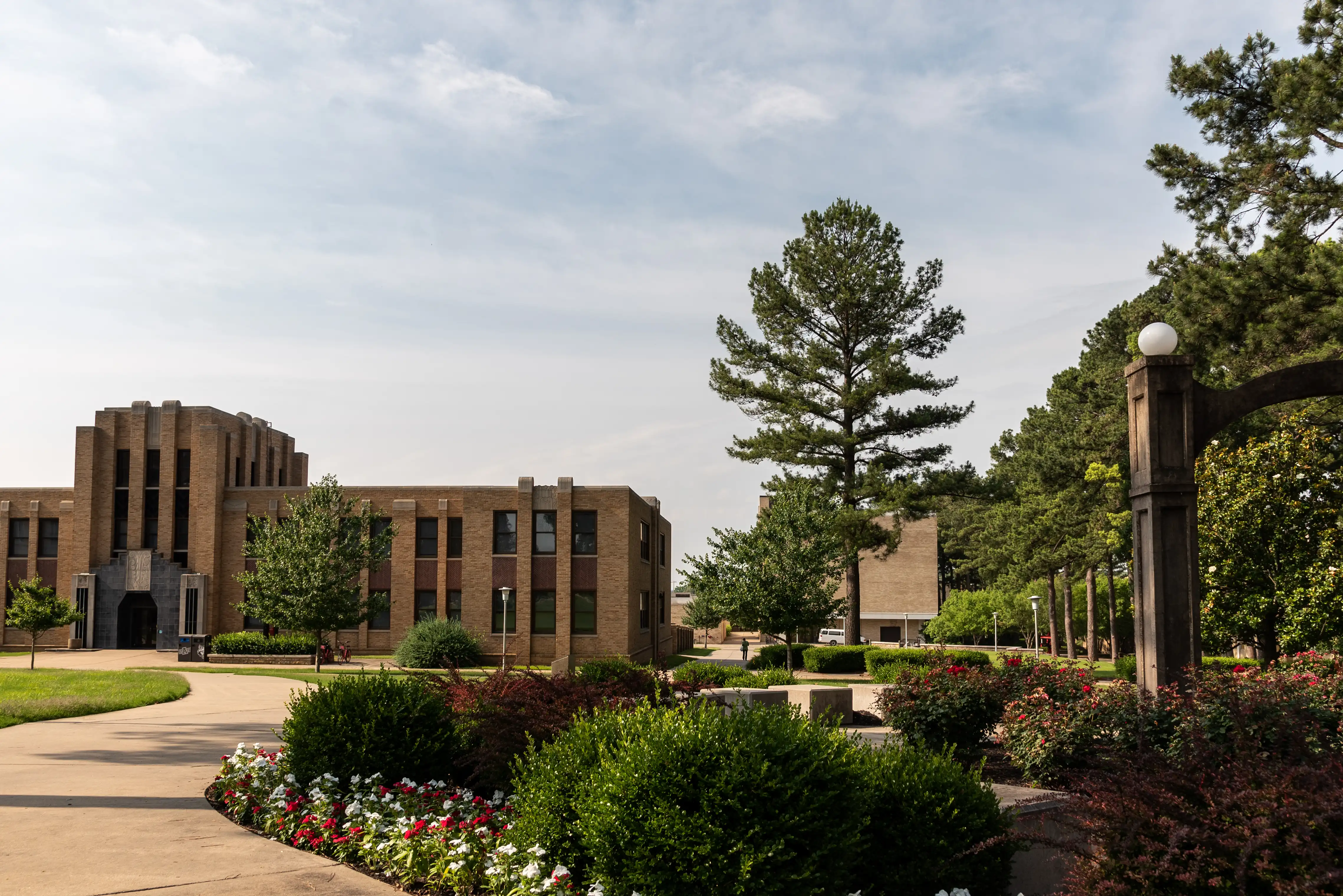 Math and Science building on campus with a large blue sky overhead.