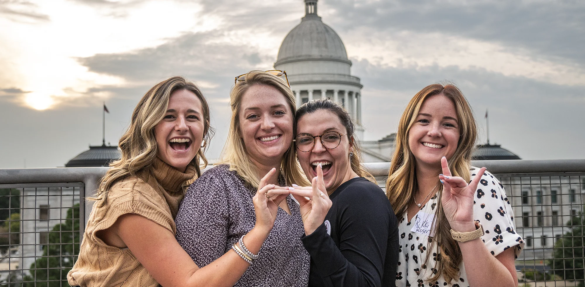 Students giving Wolves Up in front of the state capitol in Little Rock.
