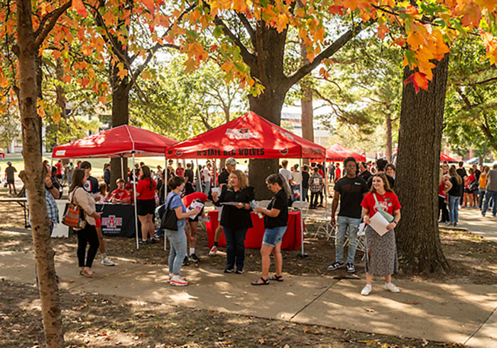 campus event with tents and A-State students and staff