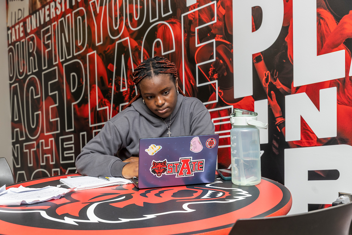An A-State student studies in the non-traditional student lounge.