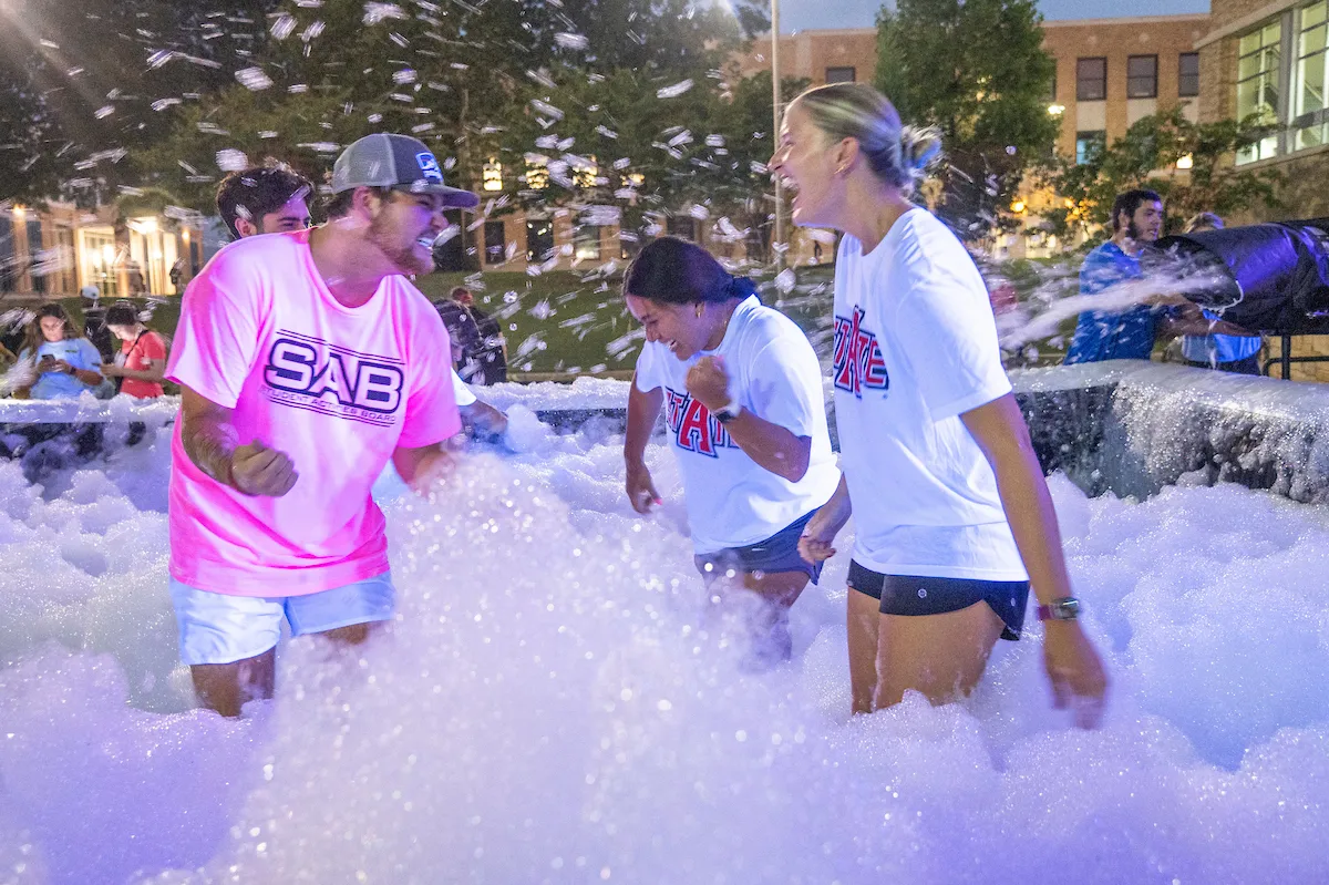 Students let loose at SAB’s foam party in front of the student union.