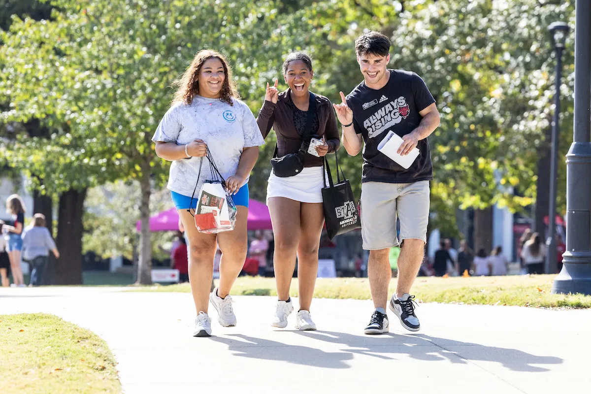 Students walk around campus during a Pack Preview event.