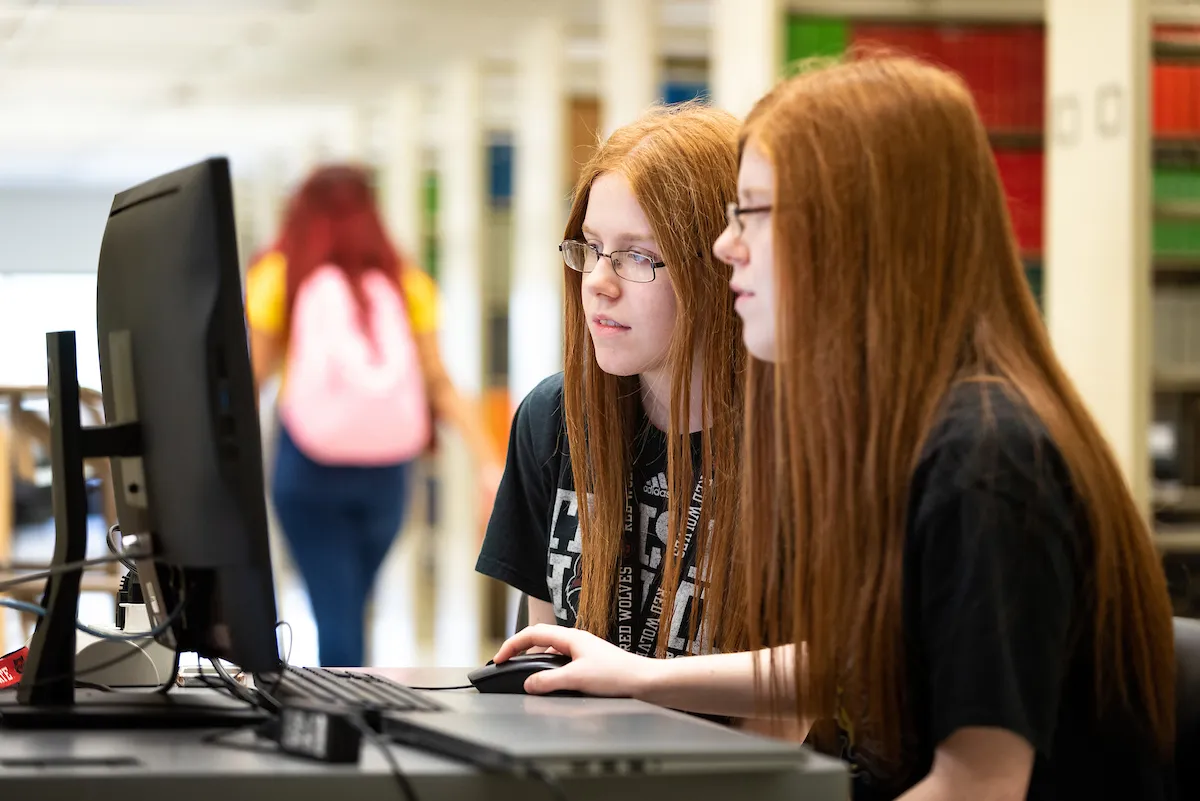 Information Technology software being downloaded by students on a computer