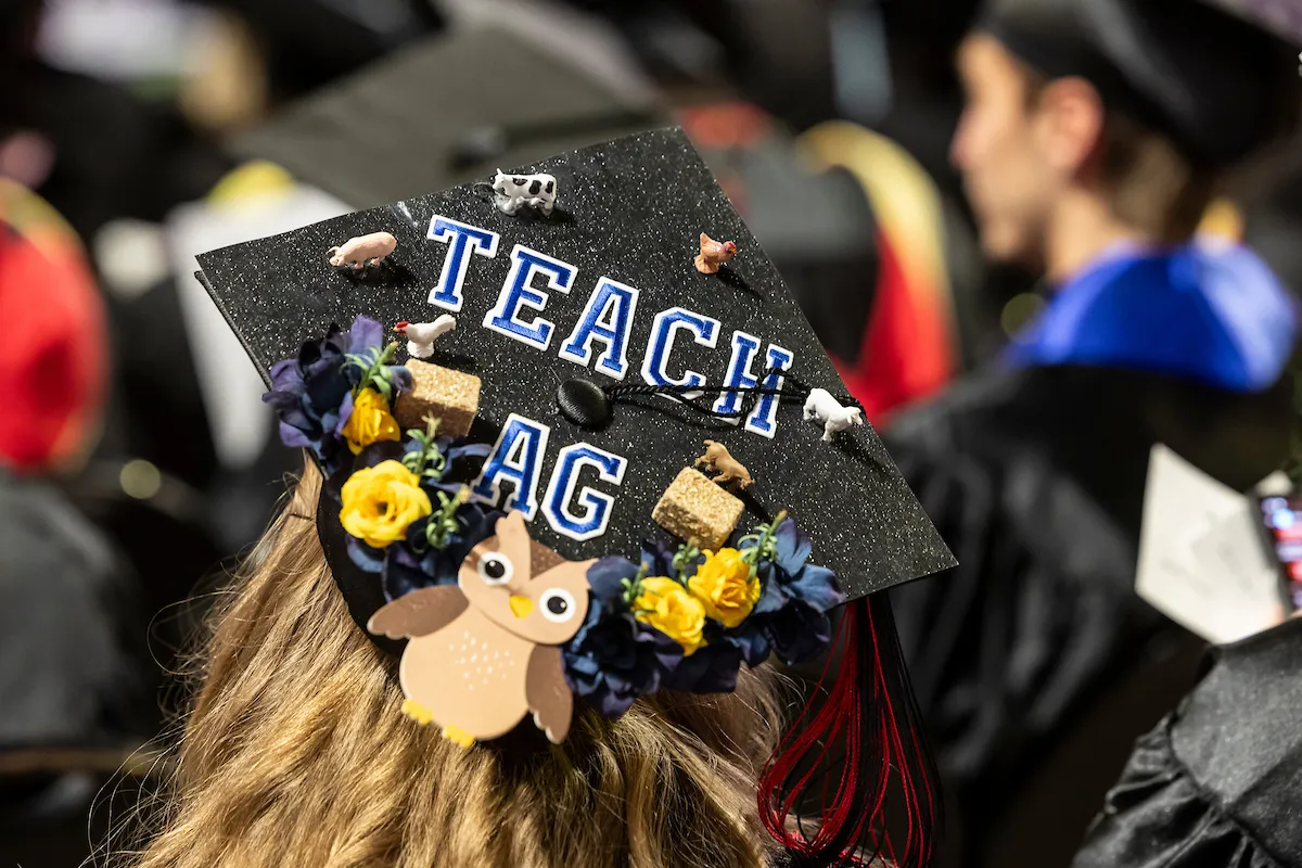 A mortar board that says Teach Ag