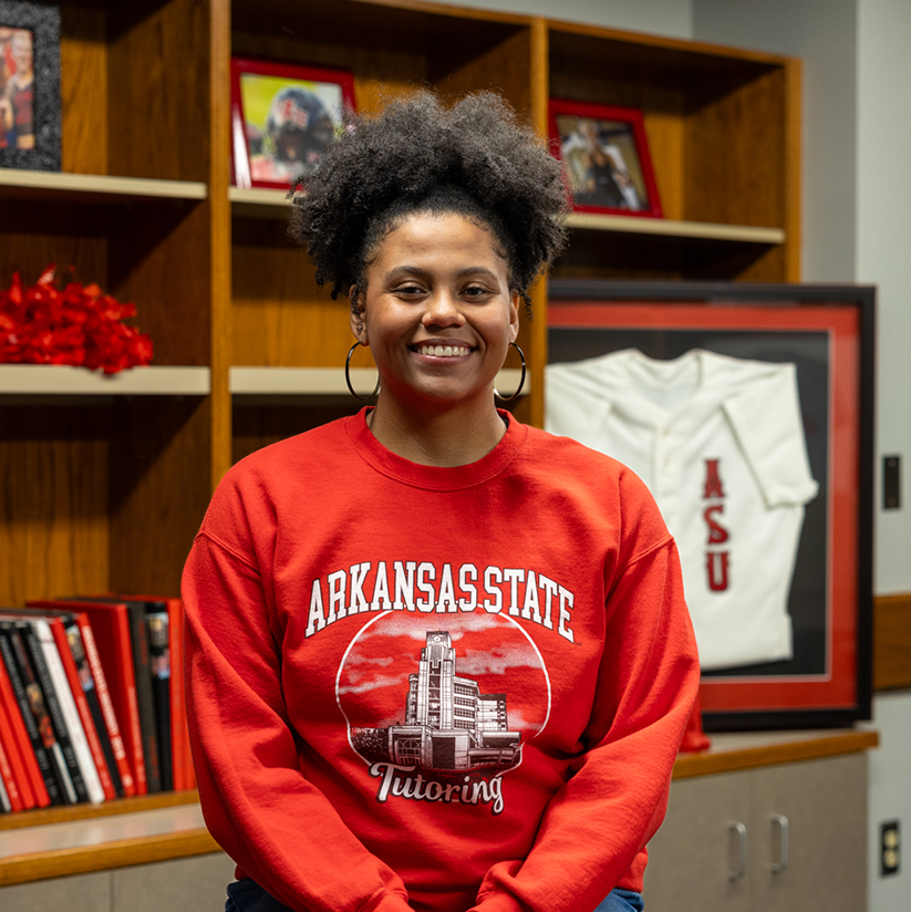Image of Alum, Amber Yates sitting down for interview